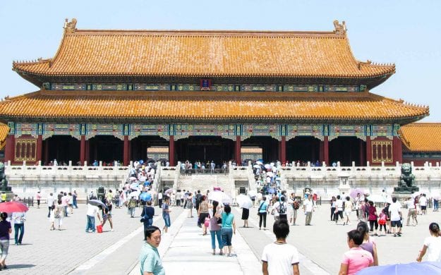 Travelers wander around China palace plaza